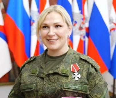 Анна Сидоренко, что стояла рядом с В.В. Путиным - реальный человек.